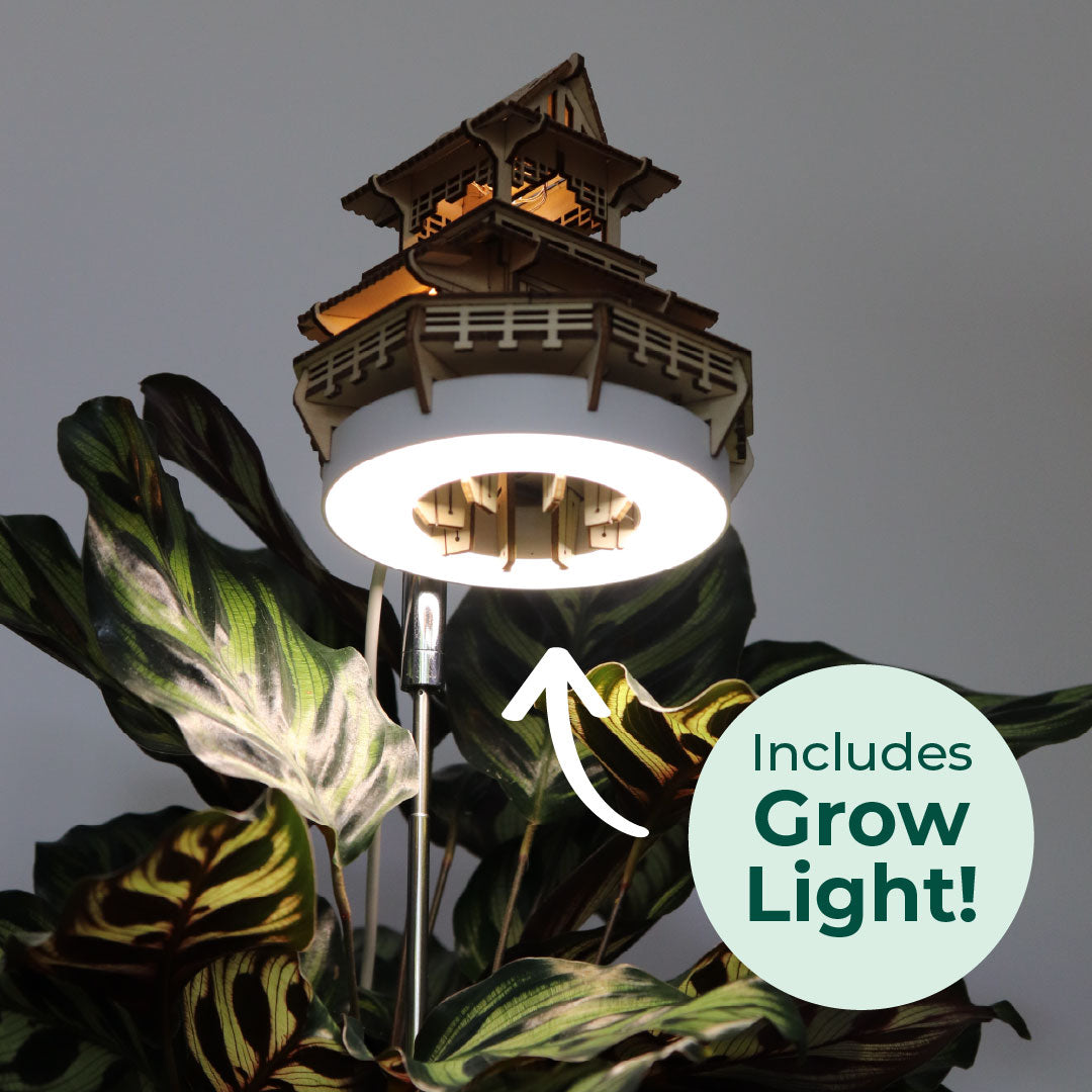 Decorative pagoda-style garden light with tiny treehouse with Grow Light