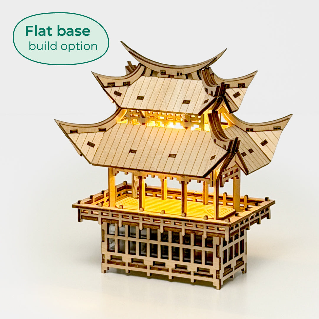 Tiny Treehouses 3D Puzzle Wooden Tiny Treehouse 3D Puzzles model of a pagoda with illuminated interior on a white background