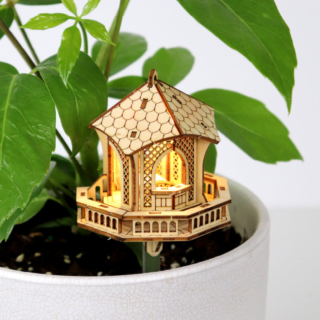 Tiny Treehouses 3D Puzzle Twighlight Gazebo Mini Tiny Treehouse 3D Puzzles nestled in a pot plant.