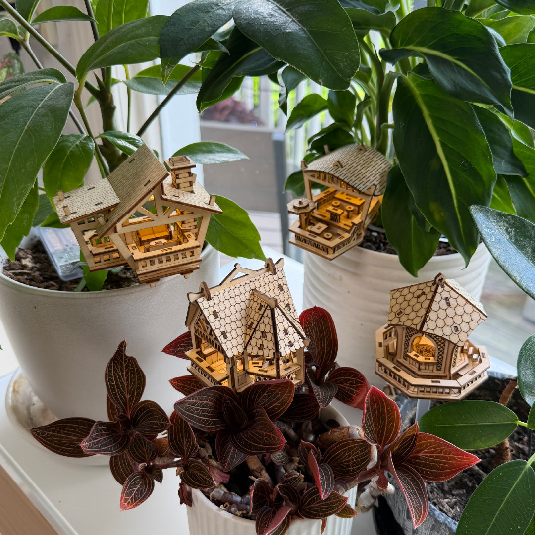 Tiny Treehouses 3D Puzzle Mini Tiny Treehouse 3D Puzzles nestled in pots showing all 4 models