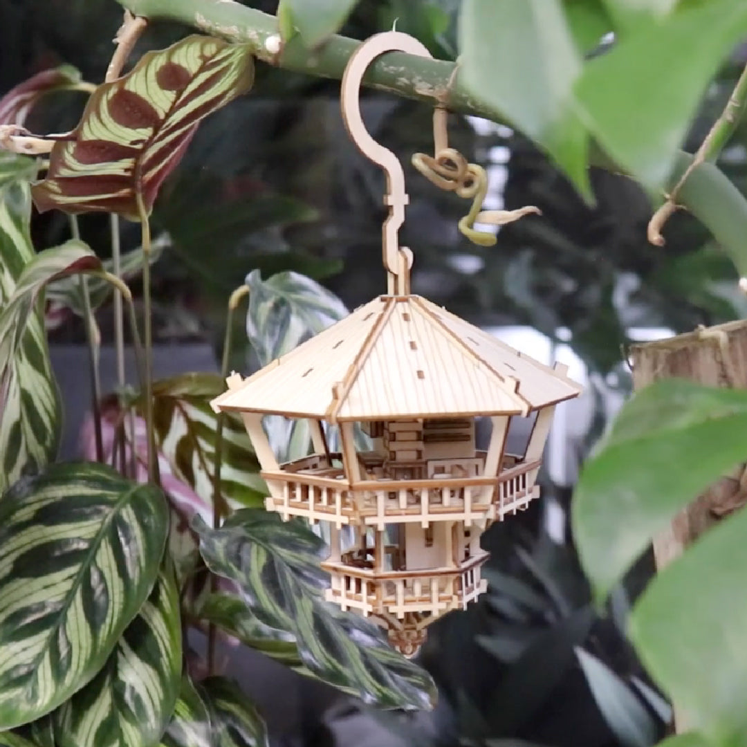 Tiny Treehouses 3D Puzzle Wooden model hanging among green leaves
