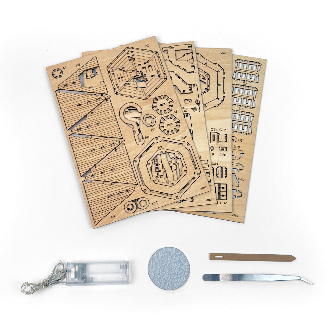 Tiny Treehouses 3D Puzzle Wooden laser-cut building kit with tools on a white background
