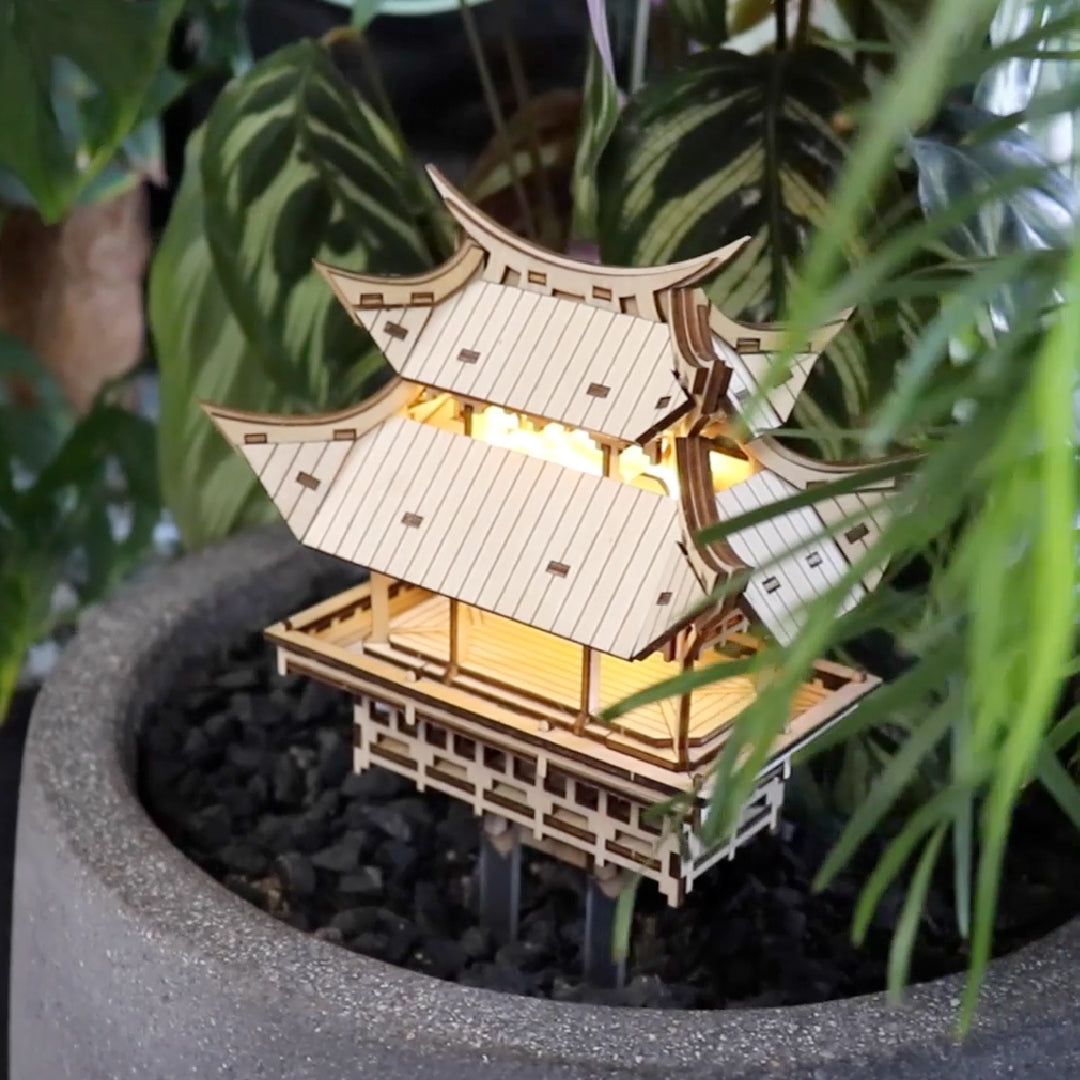 Tiny Treehouses 3D Puzzle Wooden pagoda model with lights inside a pot with plants