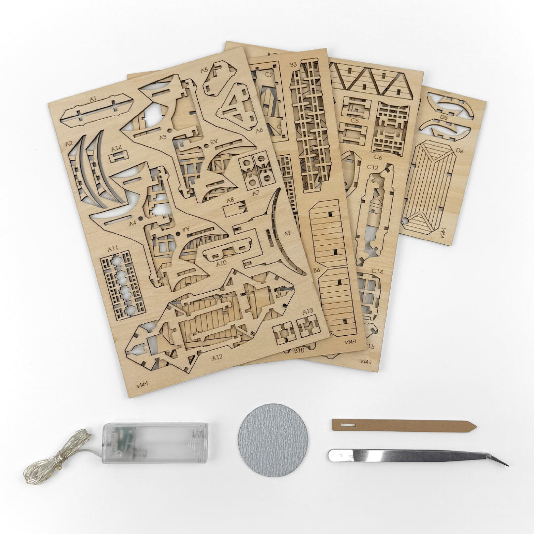 Tiny Treehouses 3D Puzzle Set of laser-cut wooden components for a model kit on a white background